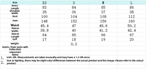Tabella taglie dettagliata per abito a pois con misure da XS a L in centimetri