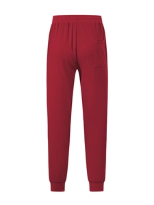 Detail of red waffle knit fabric texture and elastic waistband on men's jogger pants