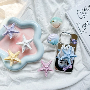 Pastel starfish and seashell magnetic phone grip stands in various colors for desks