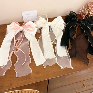 Elegant large lace ribbon bow hair clips in pink, beige, and black for women