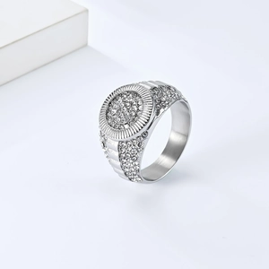 Macro view of iced out men's hip hop ring with white zircon pave setting and radial grooves