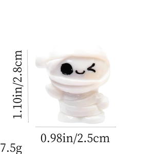 Macro shot of miniature white mummy figurine with specific size and weight measurements