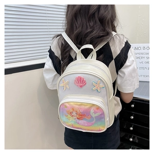 Detail of girls mermaid backpack showing 3D sequin starfish and pearl seashell patch