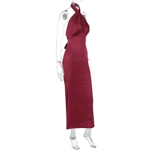 Close-up of wine red satin halter dress showing pleated chest detail and silky texture