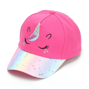 Close-up of unicorn embroidery and sequin star details on kids baseball cap