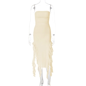 Detail of ruched beige tube dress with asymmetric ruffled hem on mannequin
