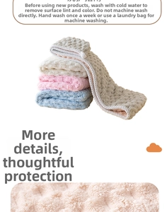 Detail of coral fleece hair towels in pink, blue and white with waffle weave texture