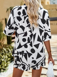 Outdoor back view of casual two-piece summer set with black and white geometric print