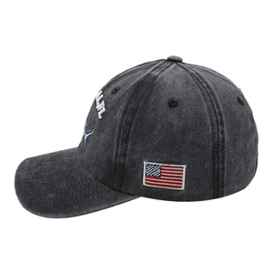 Side view of washed grey baseball cap featuring shark embroidery and USA flag patch
