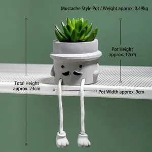Detail of creative succulent cement pot featuring human-like face and rope hanging legs