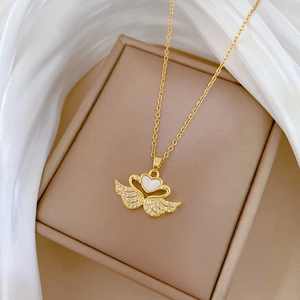 Elegant gold titanium steel necklace with shell heart and diamond-encrusted wings