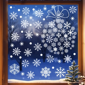 Detailed white snowflake Christmas ball window sticker on glass with winter forest backdrop