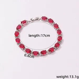 Macro view of copper plated bracelet with red oval zircons and micro-pave detailing