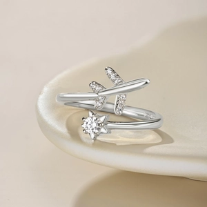 Macro shot of S925 silver airplane ring featuring sparkling zircon and sun star detail