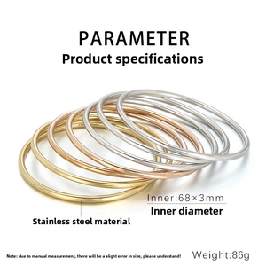 Detailed view of 7-piece stainless steel stacking bangles with 68mm inner diameter