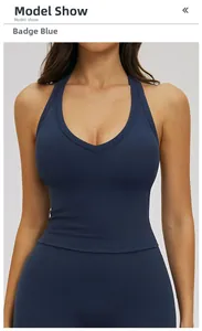 Front view of tight-fitting V-neck yoga tank top in badge blue color on a model