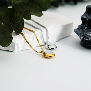 French vintage oval shell necklace in gold and silver finish with moonstone inlay