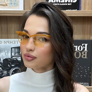 Fashionable amber cat-eye sunglasses with semi-rimless frames and gold metal temples
