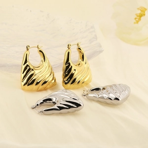 Textured hoop earrings in gold and silver finish with elegant wavy snake pattern