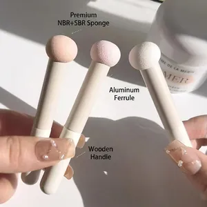 Three mushroom-head sponge concealer brushes with wooden handles and aluminum tubes