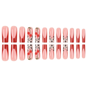 Red French tip press-on nails with leopard print and 3D cherry accents in coffin shape