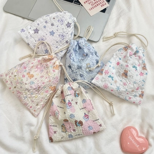 Detailed set of five cartoon seersucker drawstring storage bags with cute animal prints