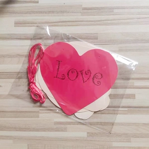Pink and white heart bunting with Love glitter lettering for wedding wall decor