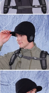 Close-up of winter knit baseball cap with ear flaps and snowflake pattern for cold weather