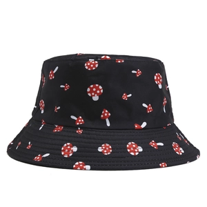 Detail of a black bucket hat featuring an all-over red and white mushroom pattern print