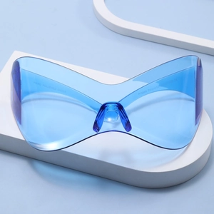 Futuristic blue Y2K oversized wrap-around sunglasses with a sleek one-piece shield lens