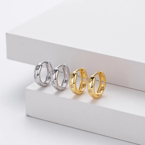 Detailed view of S925 sterling silver hoop earrings with hollow stars and micro zircons