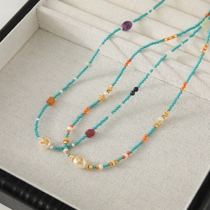 Freshwater pearl and colorful gemstone beaded necklace in an elegant black jewelry box