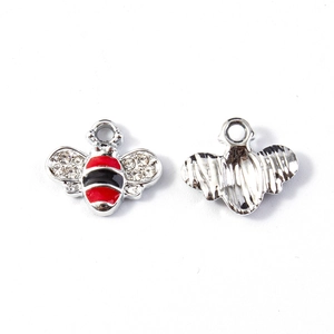 Detail of bee charms with red and black enamel stripes and sparkling rhinestones