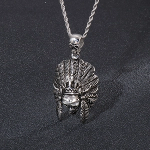 Detailed view of hip hop skull pendant with Indian chief feather headdress in steel