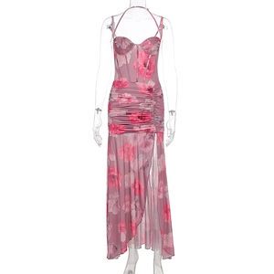 Detail of floral printed mesh dress featuring boned corset bodice and ruched slit skirt