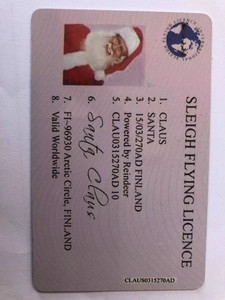 Macro shot of realistic Santa Claus Sleigh License card with detailed English text