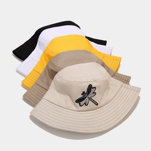 Unisex cotton bucket hats with dragonfly embroidery in black, white, and yellow colors