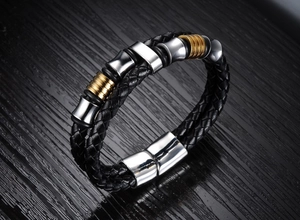 Detail of magnetic clasp on men's braided leather bracelet with gold and silver beads