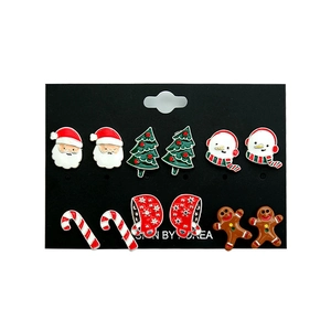 Christmas stud earring set featuring Santa, tree, and snowman on a black card display