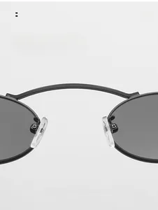 Macro detail of comfortable transparent nose pads on black oval sunglasses frame