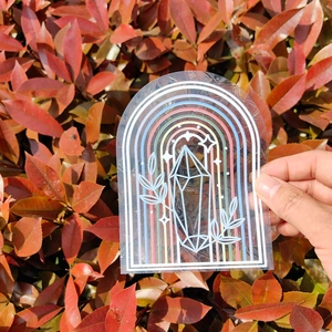 Rainbow prism window sticker with crystal and leaf design on a botanical background