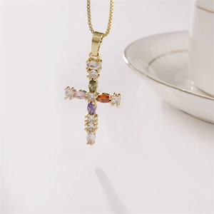 Golden copper cross necklace with multi-color zircon stones on white background