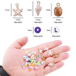 DIY jewelry making kit with starfish charms and colorful clay beads shown in hand for scale