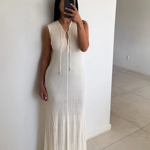 Elegant sleeveless cream knitted maxi dress with front tie lace-up V-neckline detail