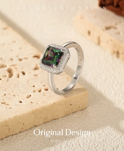 Macro detail of S925 silver ring featuring a halo-set colorful square gemstone