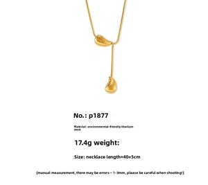Detail of 18k gold plated titanium teardrop necklace with hammered texture finish