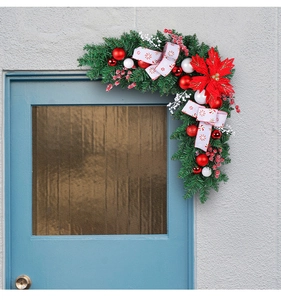 L-shaped Christmas door corner garland with red flowers, berries and festive baubles