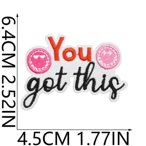 Detail view of You Got This embroidered patch showing pink smiley face and exact dimensions