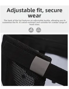 Detail of adjustable metal buckle and breathable mesh strap on black baseball cap