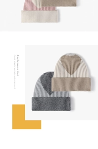 Detail of rib-knitted beanie featuring contrasting triangle patterns and thick winter fabric